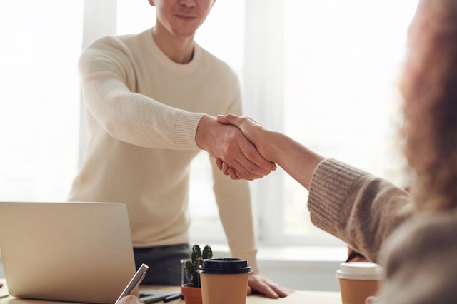 two people shaking hands after completing tenant screening